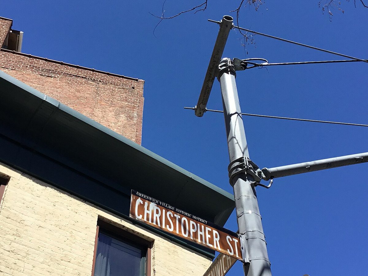 Storefronts and pedestrians on Christopher Street in the West Village