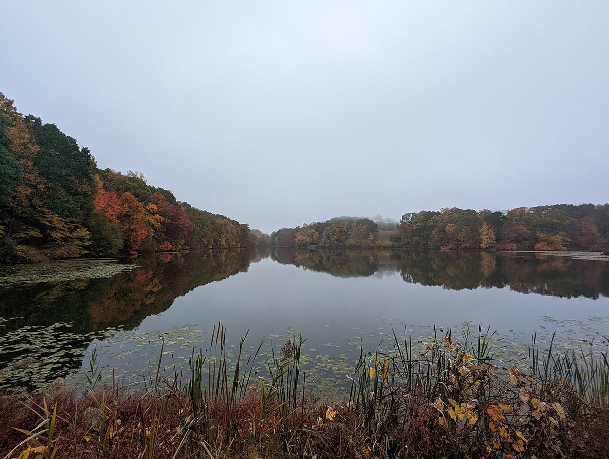 Carriage road trail beside a lake at Rockefeller State Park Preserve in Sleepy Hollow