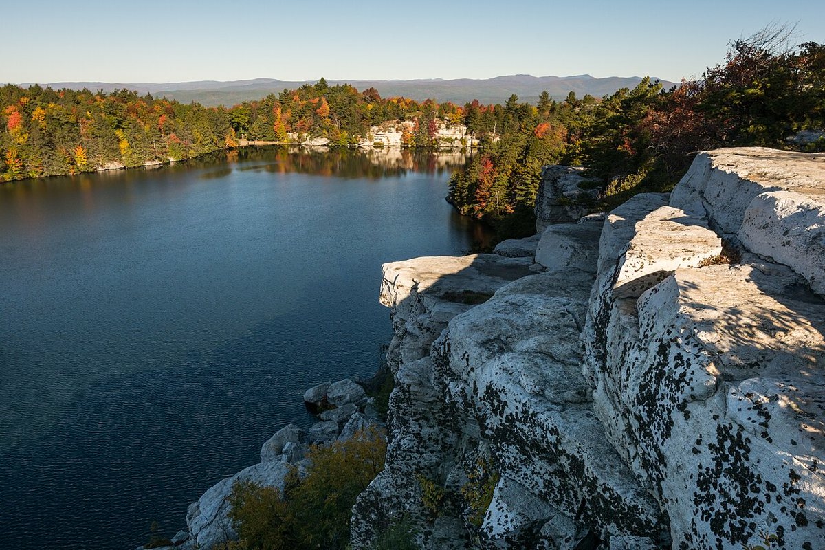 Cliffs surrounding a clear sky lake at Minnewaska State Park Preserve