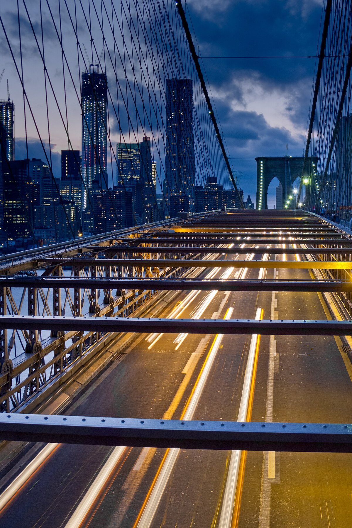 Brooklyn Bridge pedestrian walkway with Manhattan skyline