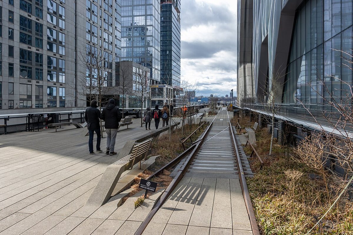Visitors walking along the raised park known as the High Line in New York City