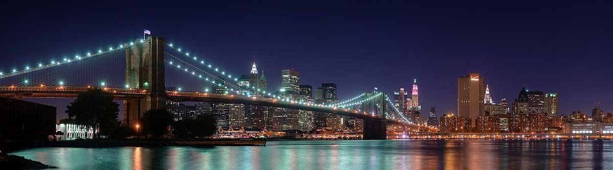 Pedestrians walking across the Brooklyn Bridge in New York City
