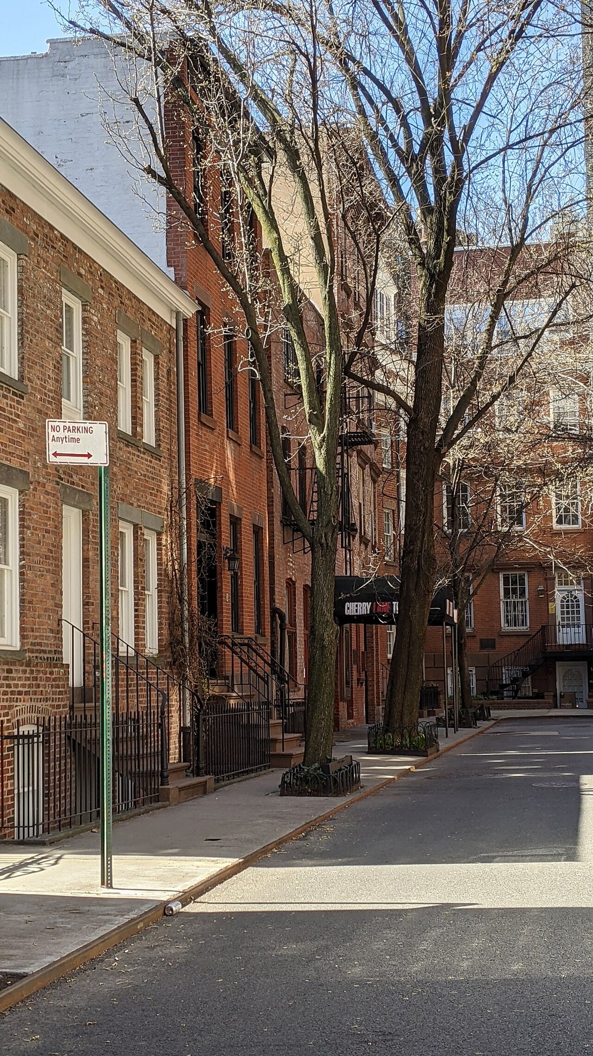 the curved brick rowhouses on Commerce Street near the Cherry Lane Theatre