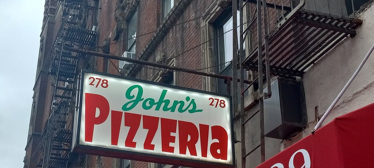the John's of Bleecker Street pizzeria sign on Bleecker Street